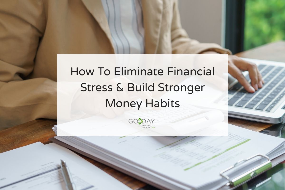 Person reviewing financial documents and using a laptop while working on budgeting and money management at a desk