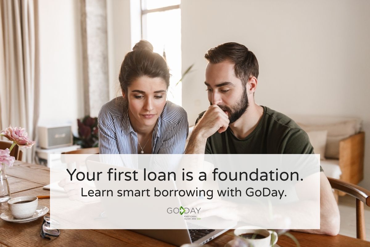oung Canadian couple researching what to know before taking their first loan, reviewing personal finance and borrowing options together on a laptop.