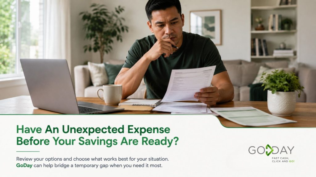 Man reviewing financial documents at home after an unexpected expense, representing short-term financial planning when emergency savings are not yet enough